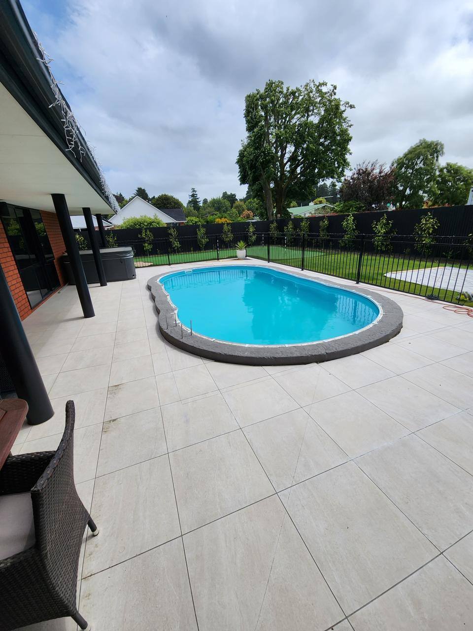 Before: pool surround with the original paving